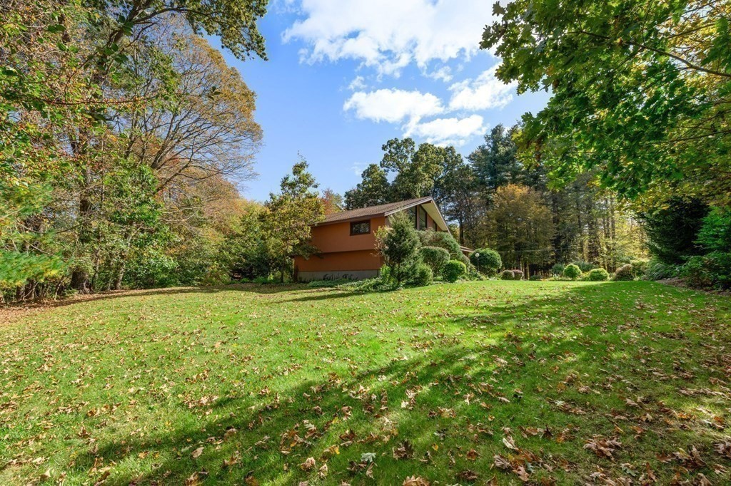 22 Maple Avenue Boxford, MA 01921 - Photo 38 of 42 a backyard of a house with lots of green space