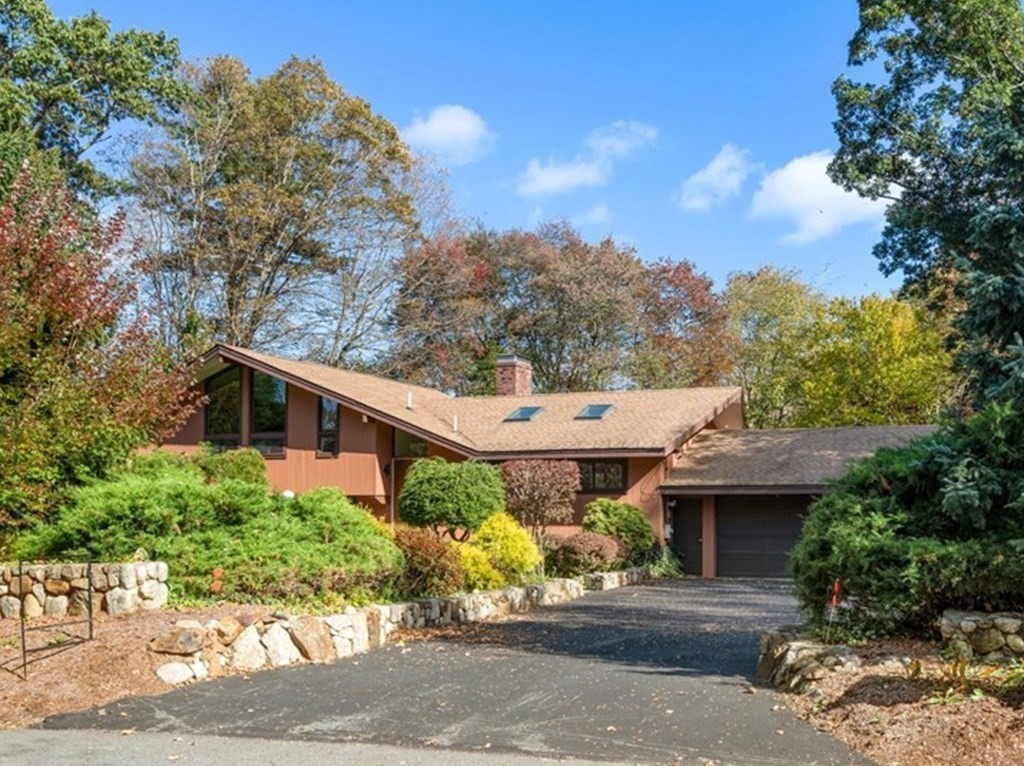 22 Maple Avenue Boxford, MA 01921 - Photo 41 of 42 a view of a white house next to a road with large trees