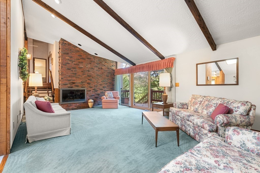 22 Maple Avenue Boxford, MA 01921 - Photo 5 of 42 a living room with furniture and a fireplace