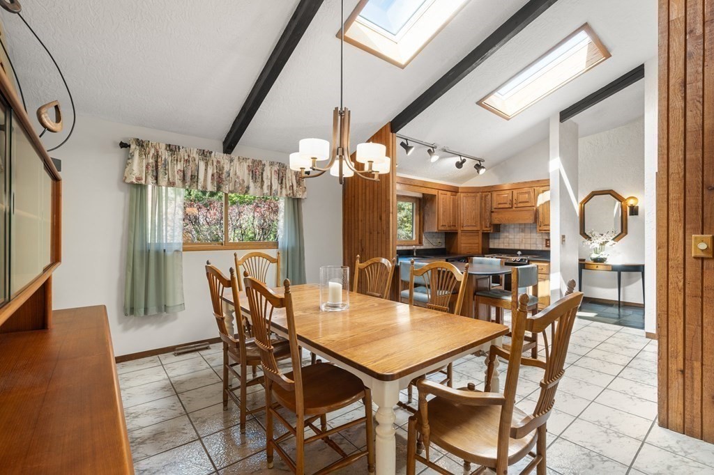 22 Maple Avenue Boxford, MA 01921 - Photo 8 of 42 a view of a dining room with furniture and a chandelier