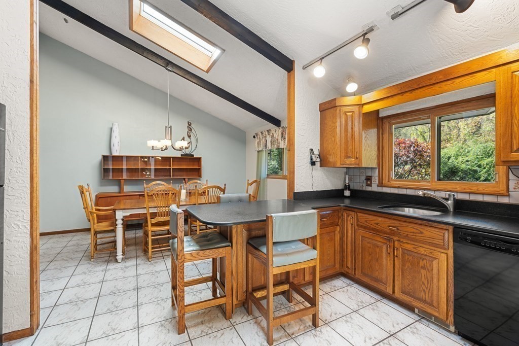 22 Maple Avenue Boxford, MA 01921 - Photo 9 of 42 a kitchen with a sink and chairs