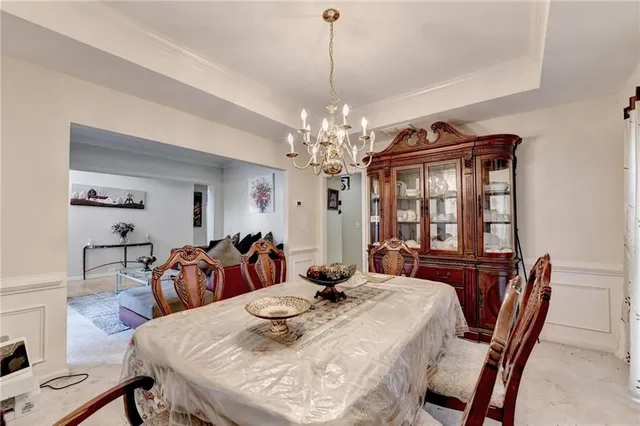 a kitchen with stainless steel appliances kitchen island granite countertop a sink and cabinets