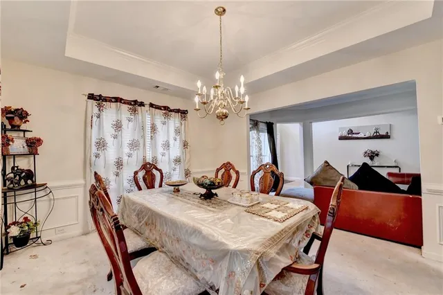 a kitchen with stainless steel appliances kitchen island granite countertop a refrigerator stove top oven and sink