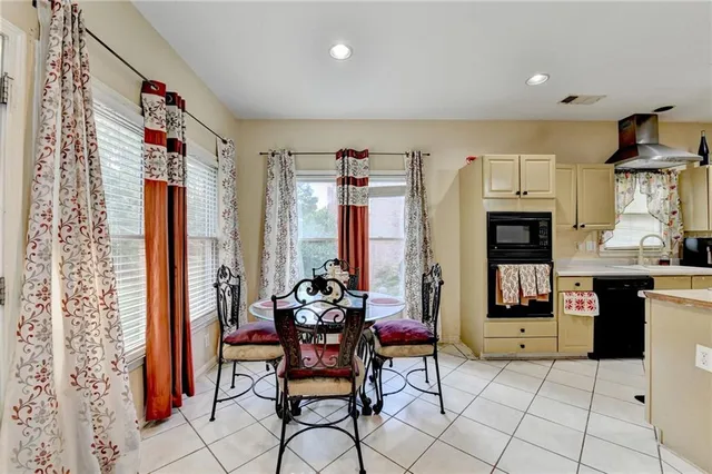 a kitchen with stainless steel appliances granite countertop a stove and a refrigerator