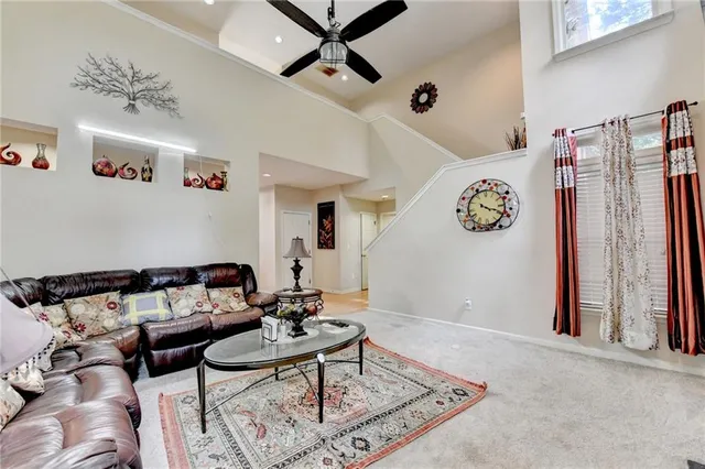 a view of a livingroom with furniture and decorative lights