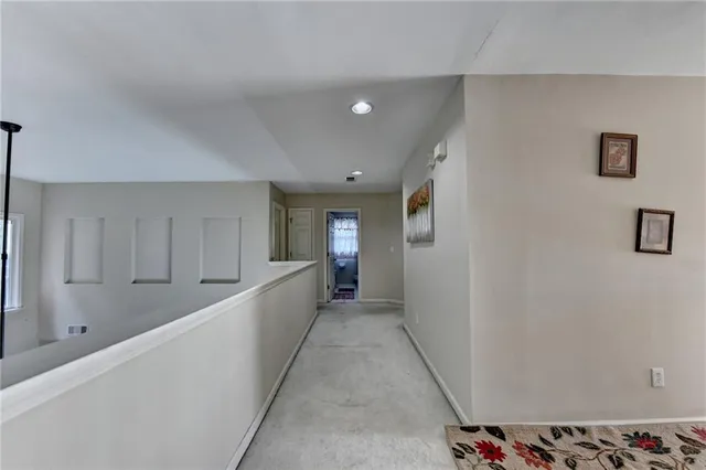 a bedroom with a bed and a television