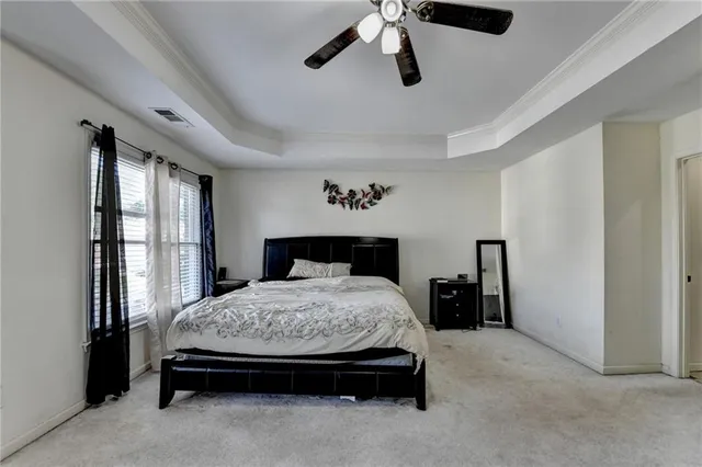 a view of a livingroom with furniture and staircase