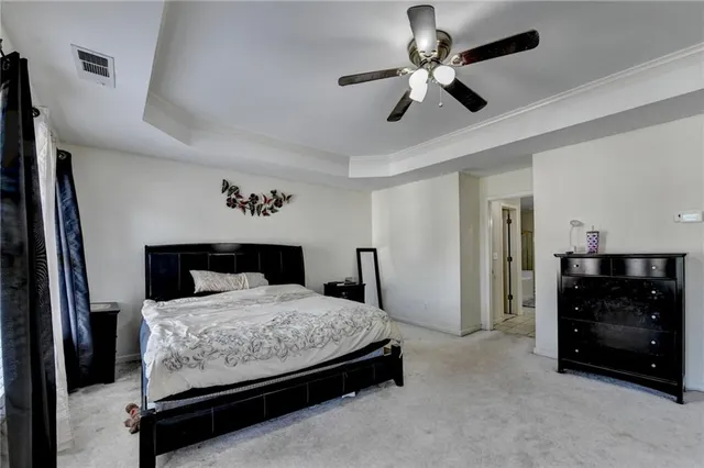 a view of walk in closet with a ceiling fan