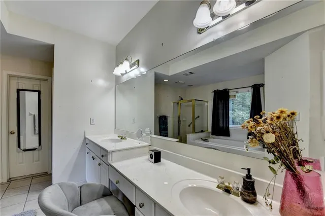 a view of a field with trees in the background