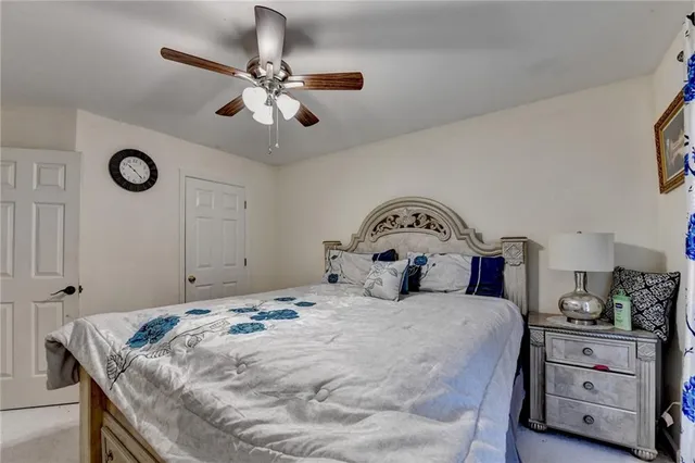 an aerial view of a house with a yard and lake view