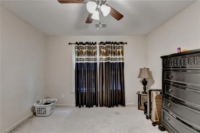 an aerial view of multiple houses with yard