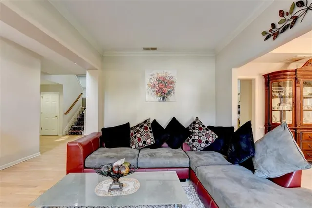 a view of a dining room with furniture and chandelier