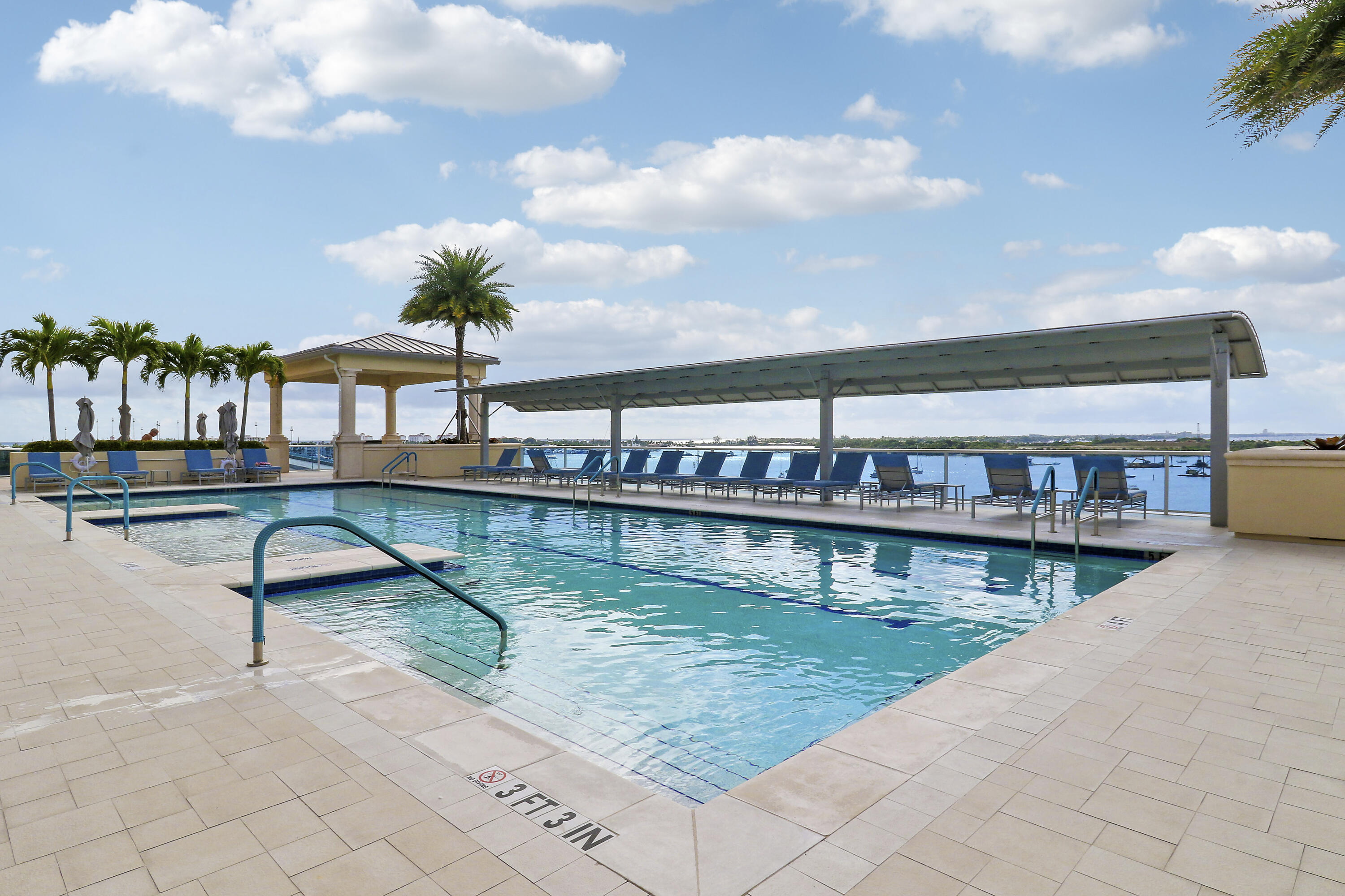 2640 Lake Shore Drive, Unit 307 Riviera Beach, FL 33404 - Photo 44 of 44 a view of a swimming pool with seating space