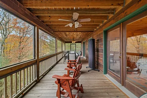 a view of a balcony with seating space