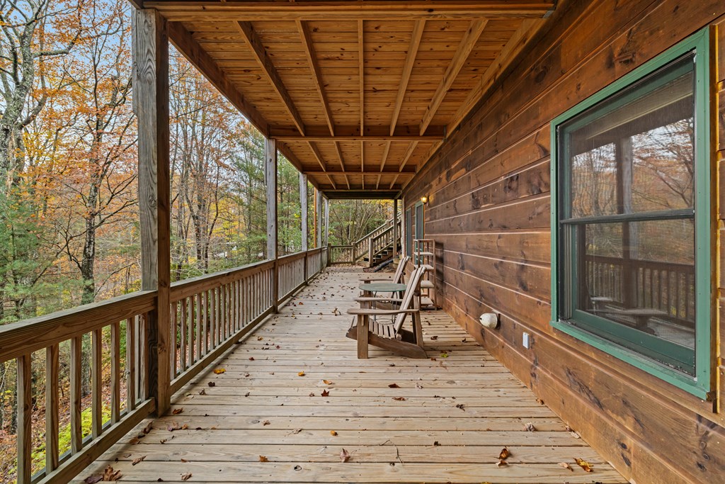 254 Aries Lane Blue Ridge, GA 30513 - Photo 21 of 43 a view of a porch with wooden floor and iron stairs