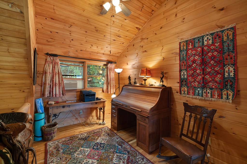 254 Aries Lane Blue Ridge, GA 30513 - Photo 23 of 43 a room with furniture and a fireplace