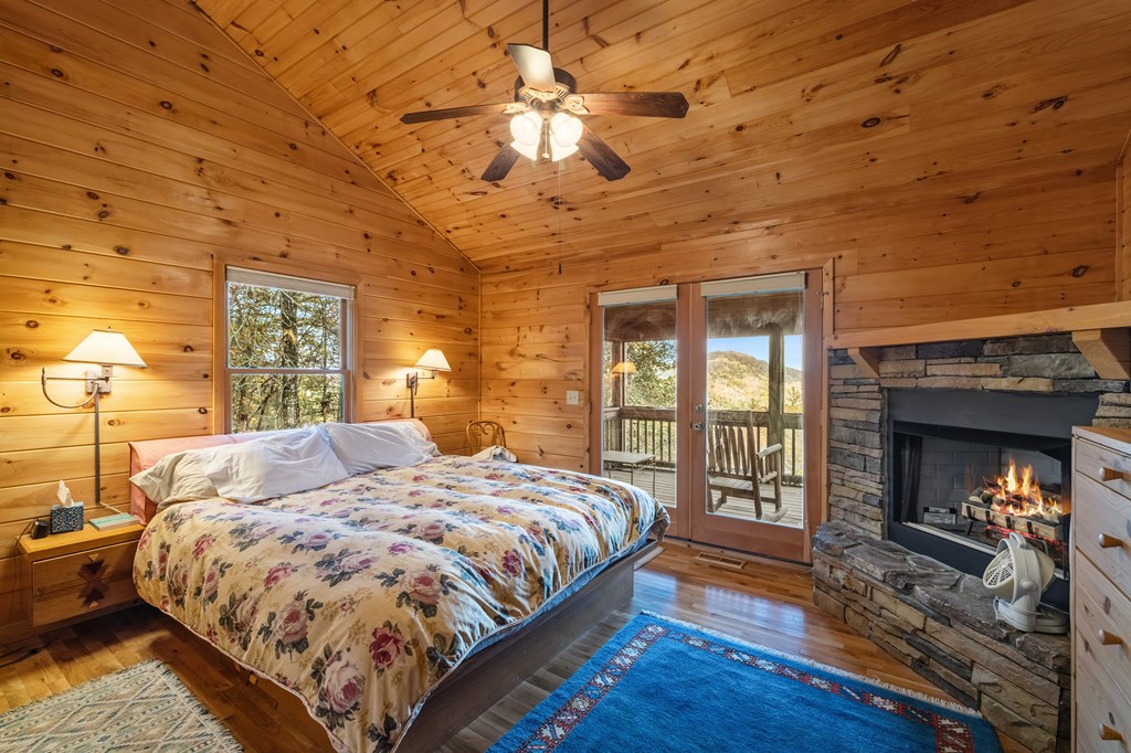 254 Aries Lane Blue Ridge, GA 30513 - Photo 24 of 43 a bed sitting in a bedroom next to a window