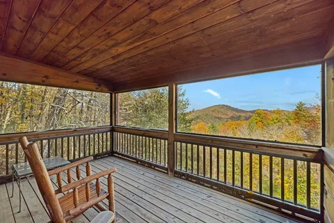 a view of a balcony with wooden floor