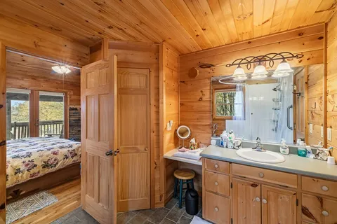 a bathroom with a double vanity sink and mirror