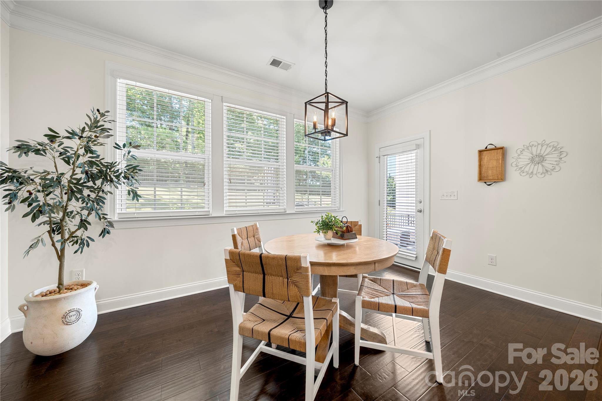 11266 Trailside Road Concord, NC 28027 - Photo 20 of 48 a view of a dining room with furniture window and wooden floor