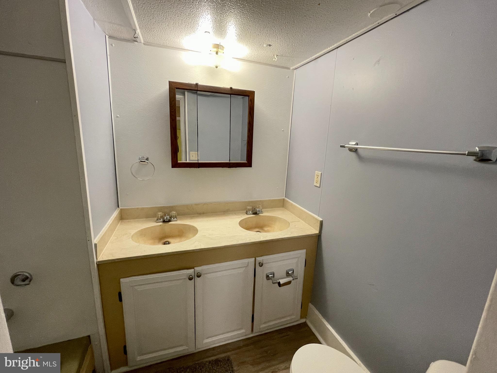 541 Fern Road Millville, NJ 08332 - Photo 10 of 15 a bathroom with a sink and a mirror