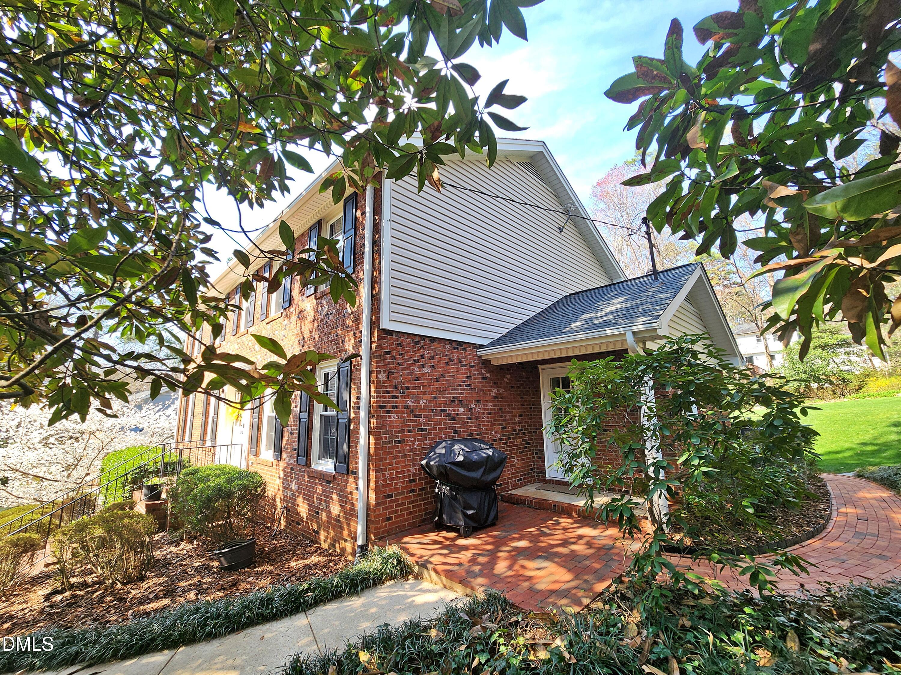 4704 Oak Park Road Raleigh, NC 27612 - Photo 12 of 62 a view of a house with backyard garden and patio