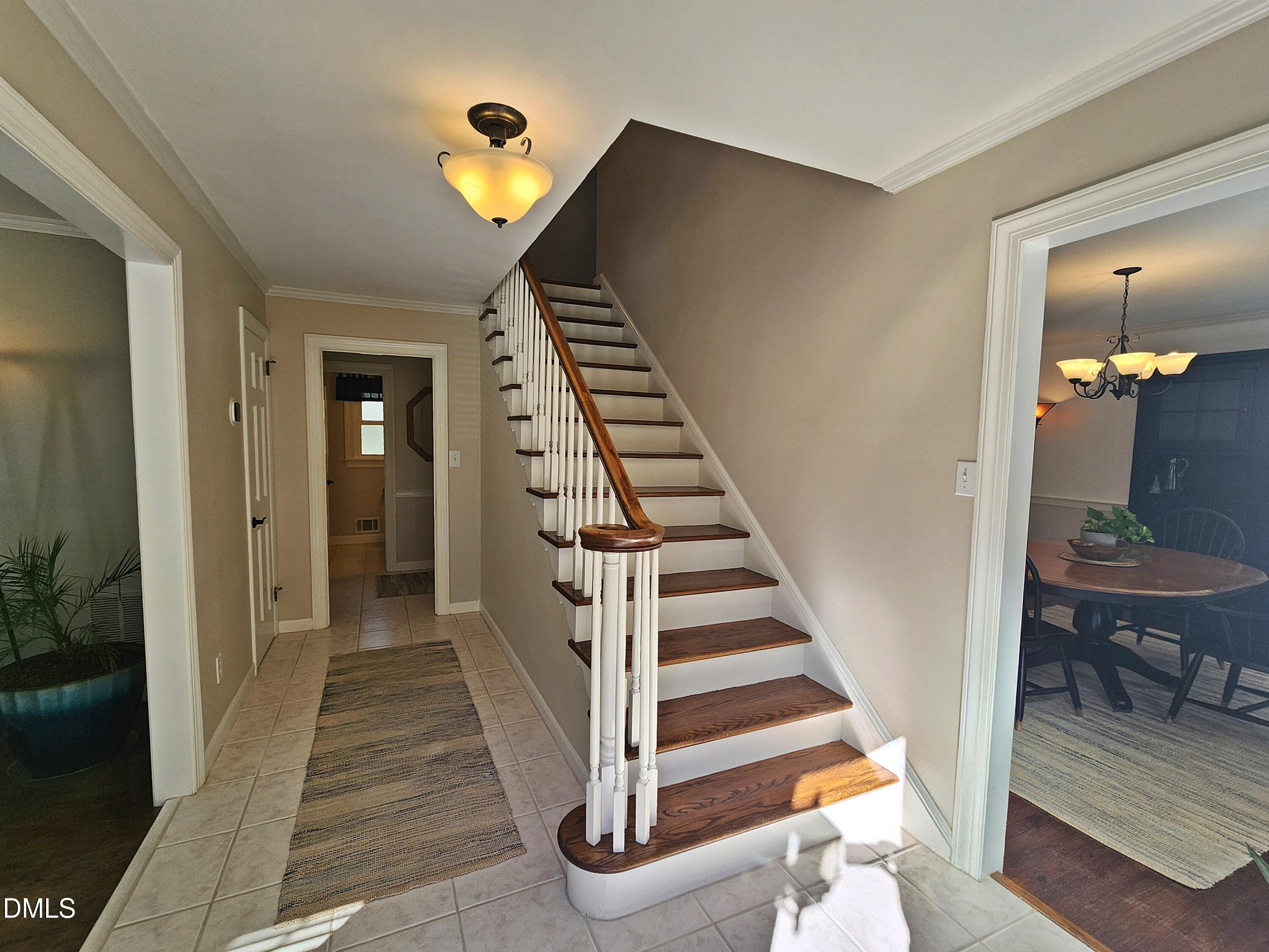 4704 Oak Park Road Raleigh, NC 27612 - Photo 13 of 62 a view of a hallway with wooden floor and entryway