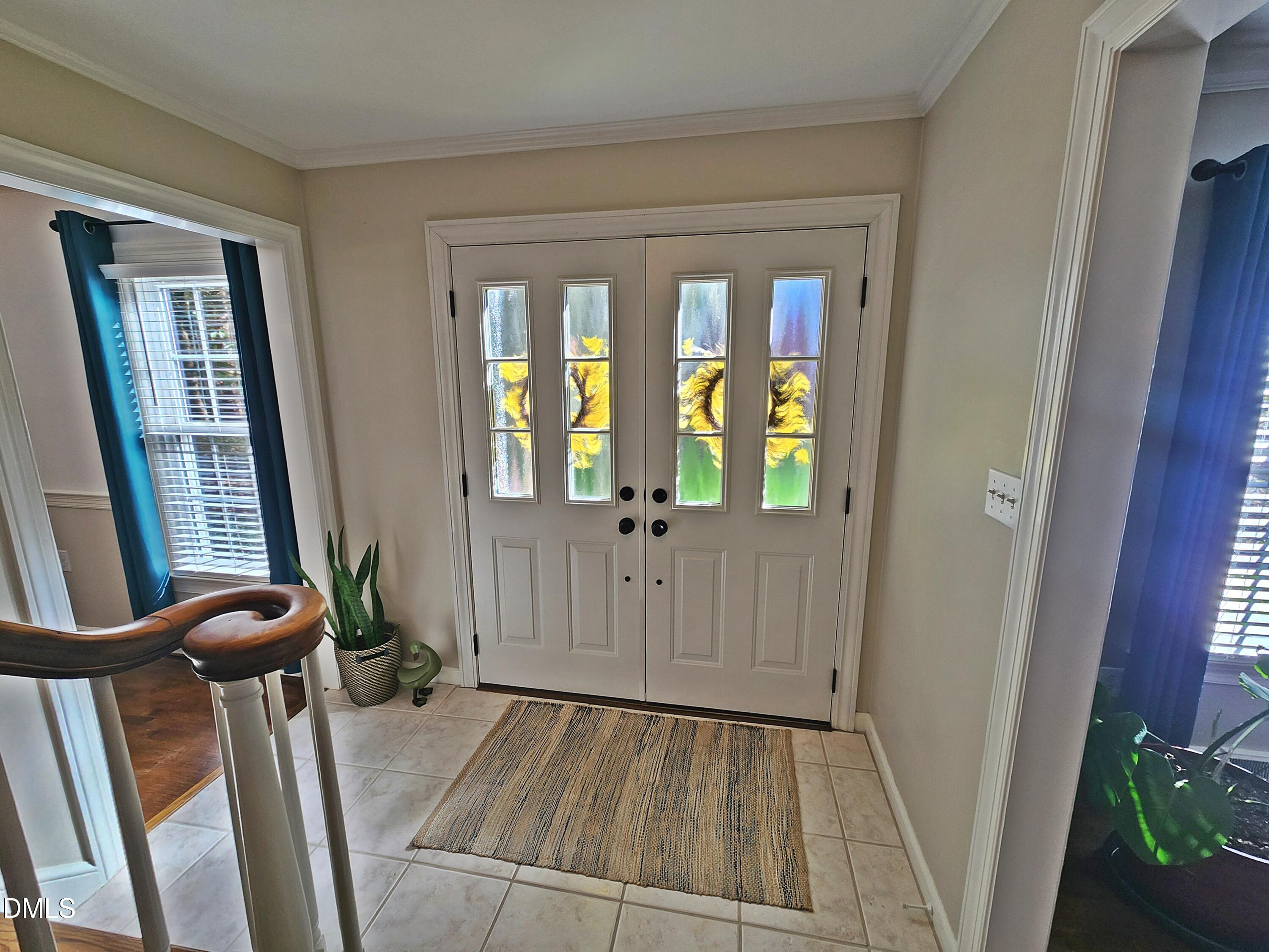 4704 Oak Park Road Raleigh, NC 27612 - Photo 15 of 62 a view of an entryway with wooden floor