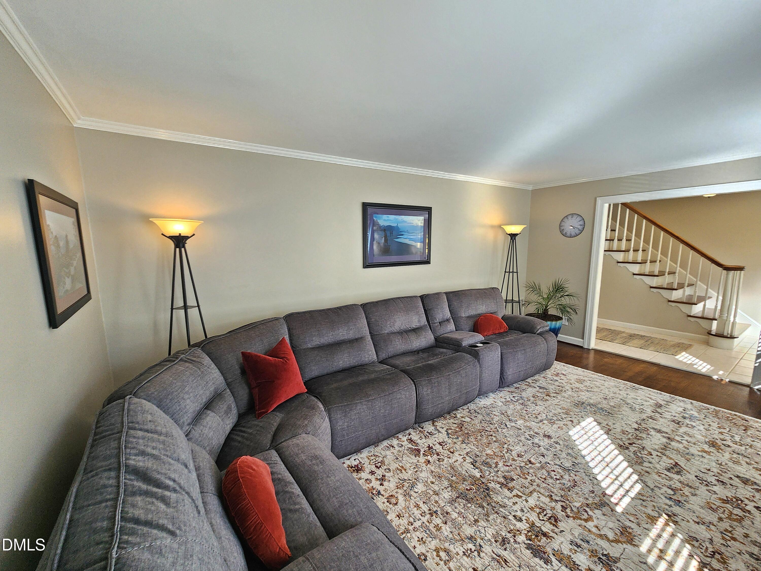 4704 Oak Park Road Raleigh, NC 27612 - Photo 19 of 62 a living room with furniture and a rug