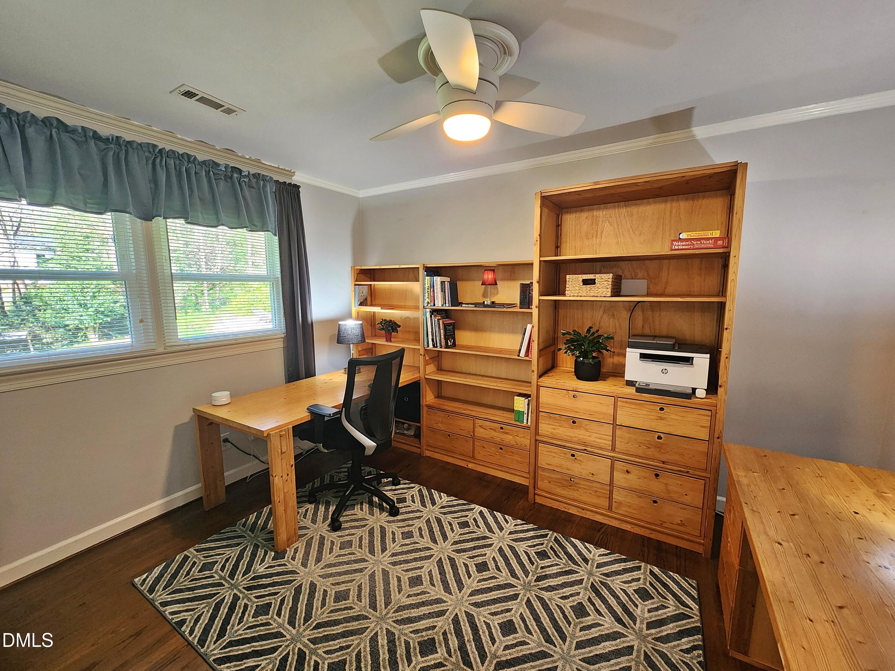 4704 Oak Park Road Raleigh, NC 27612 - Photo 40 of 62 a bed room with a bed and a window