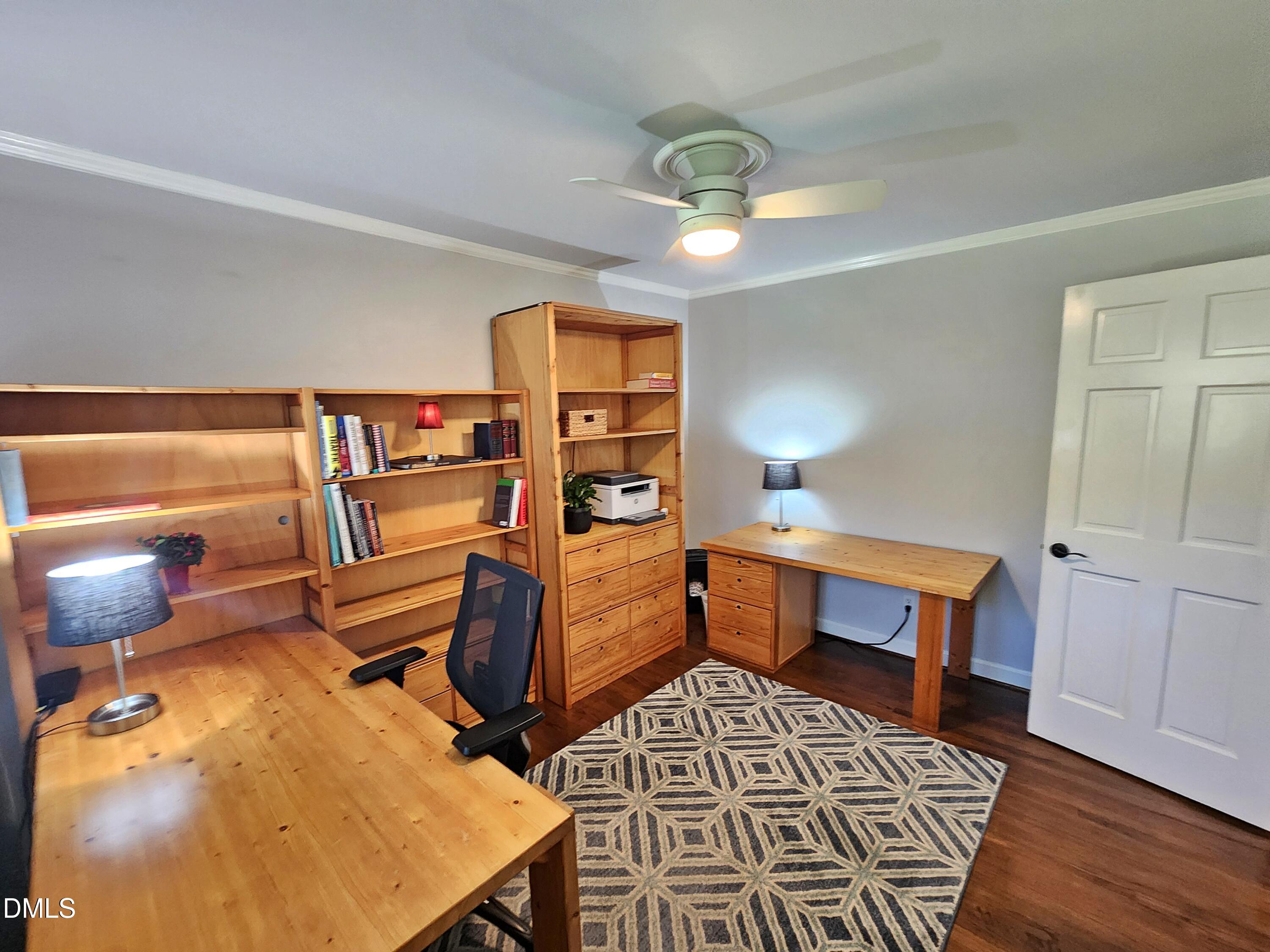 4704 Oak Park Road Raleigh, NC 27612 - Photo 41 of 62 a room with furniture and wooden floor
