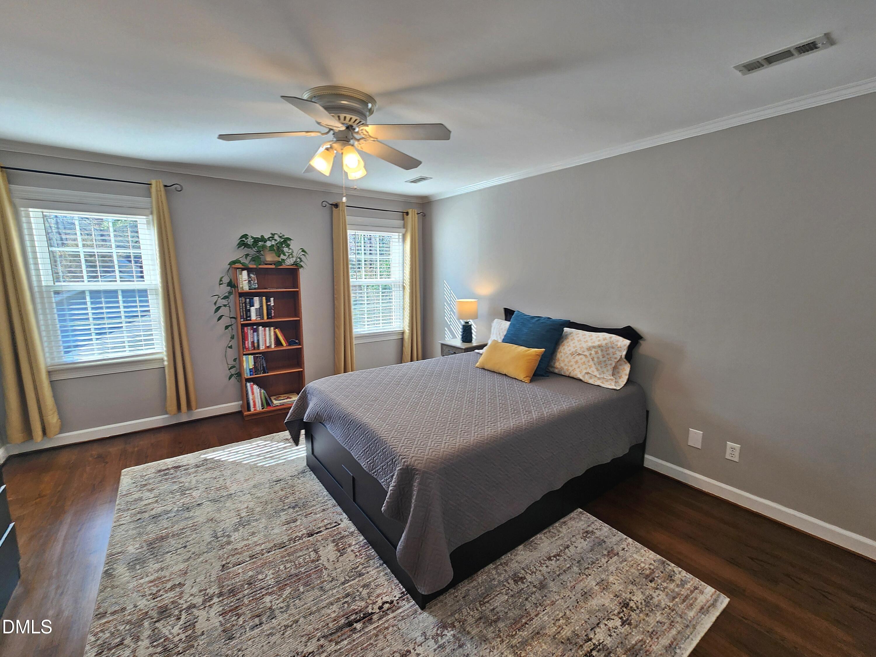 4704 Oak Park Road Raleigh, NC 27612 - Photo 46 of 62 a bedroom with a bed and a window