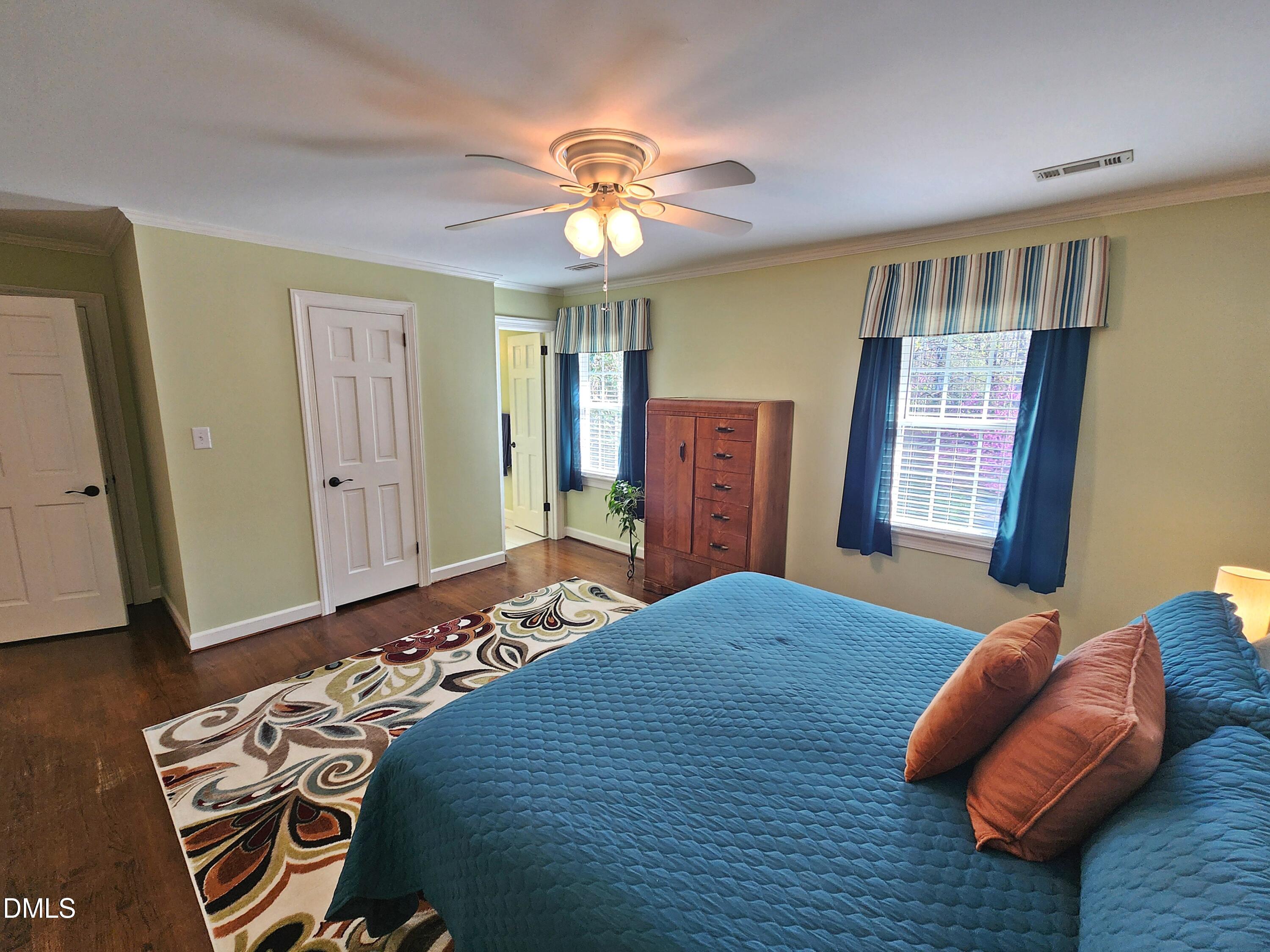 4704 Oak Park Road Raleigh, NC 27612 - Photo 50 of 62 a bedroom with a bed and a couch