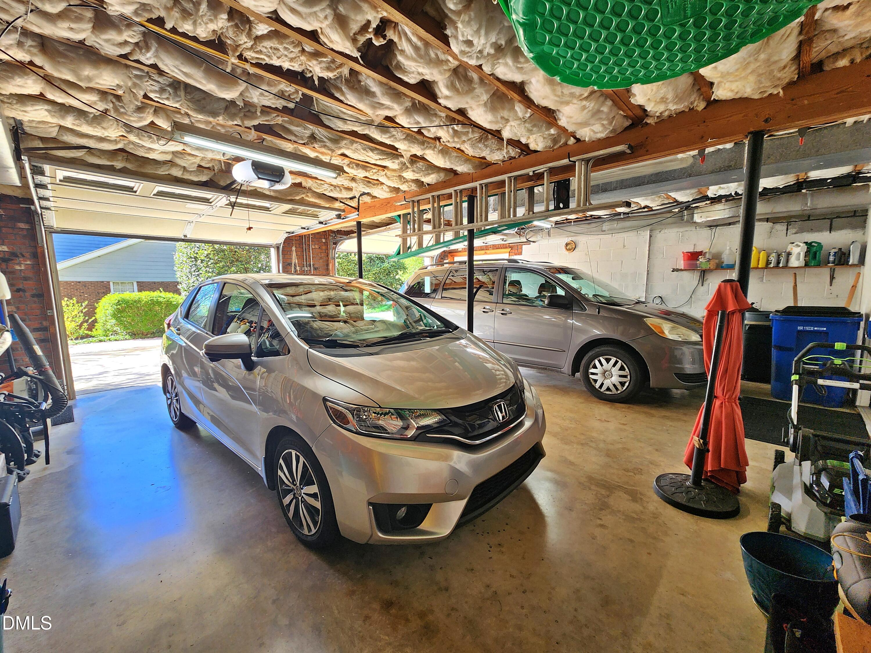 4704 Oak Park Road Raleigh, NC 27612 - Photo 57 of 62 a car parked in a garage