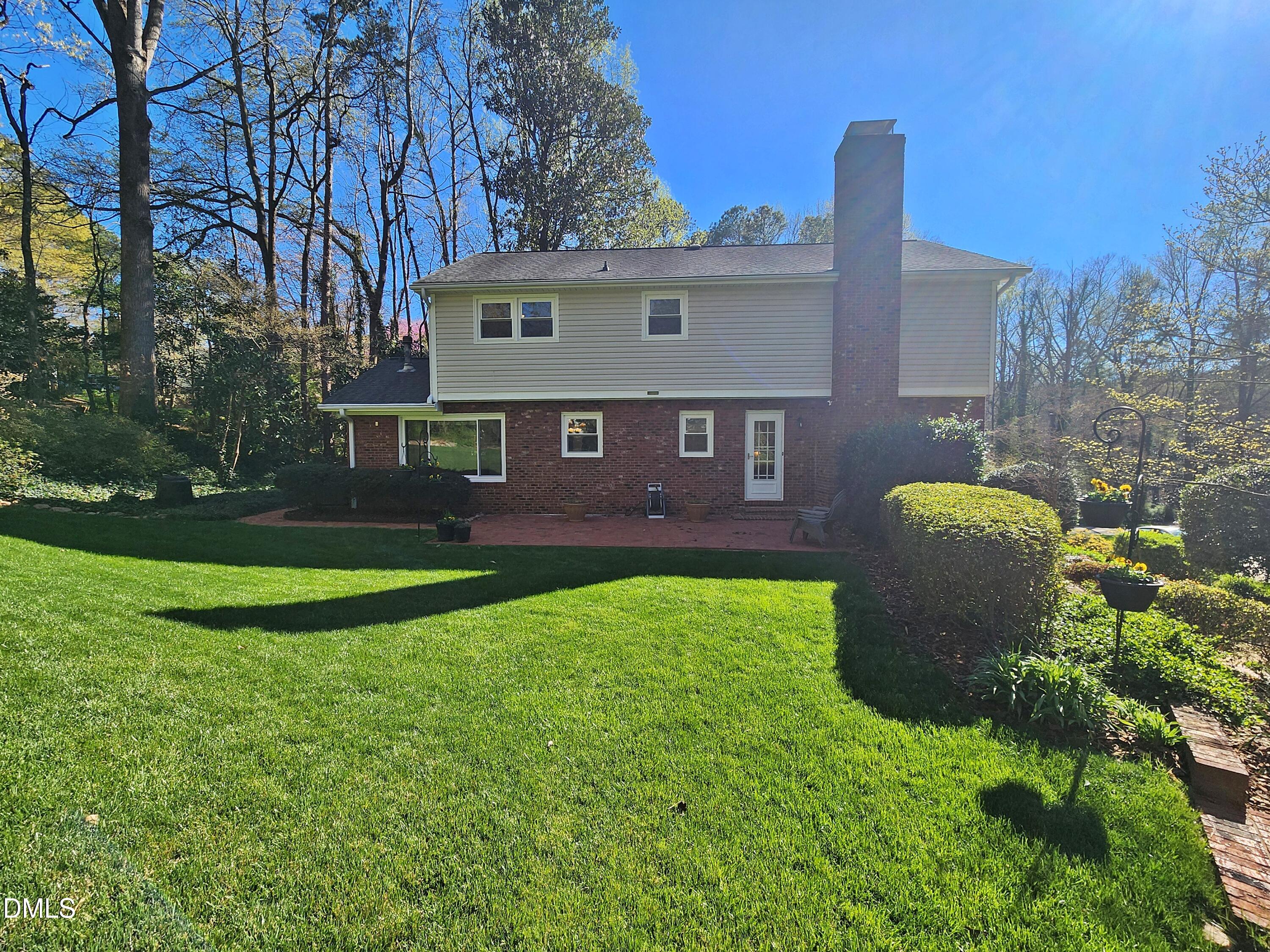 4704 Oak Park Road Raleigh, NC 27612 - Photo 8 of 62 a view of a house with backyard and a garden