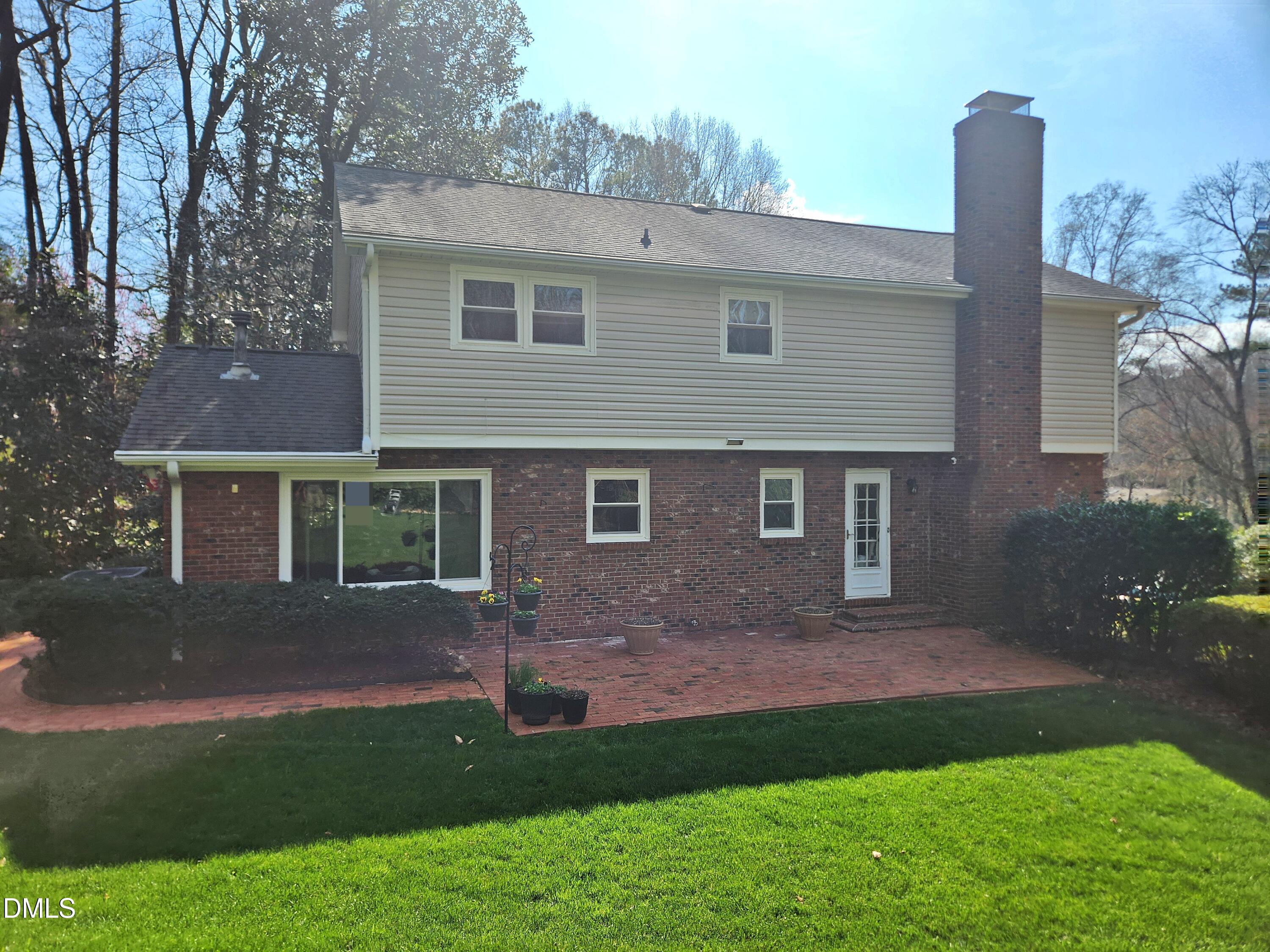 4704 Oak Park Road Raleigh, NC 27612 - Photo 9 of 62 a front view of a house with a garden