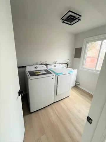a utility room with washer and dryer