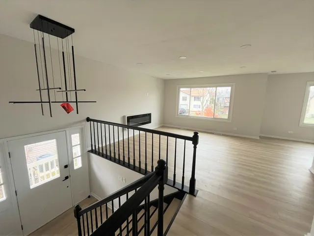 a view of a hallway with windows