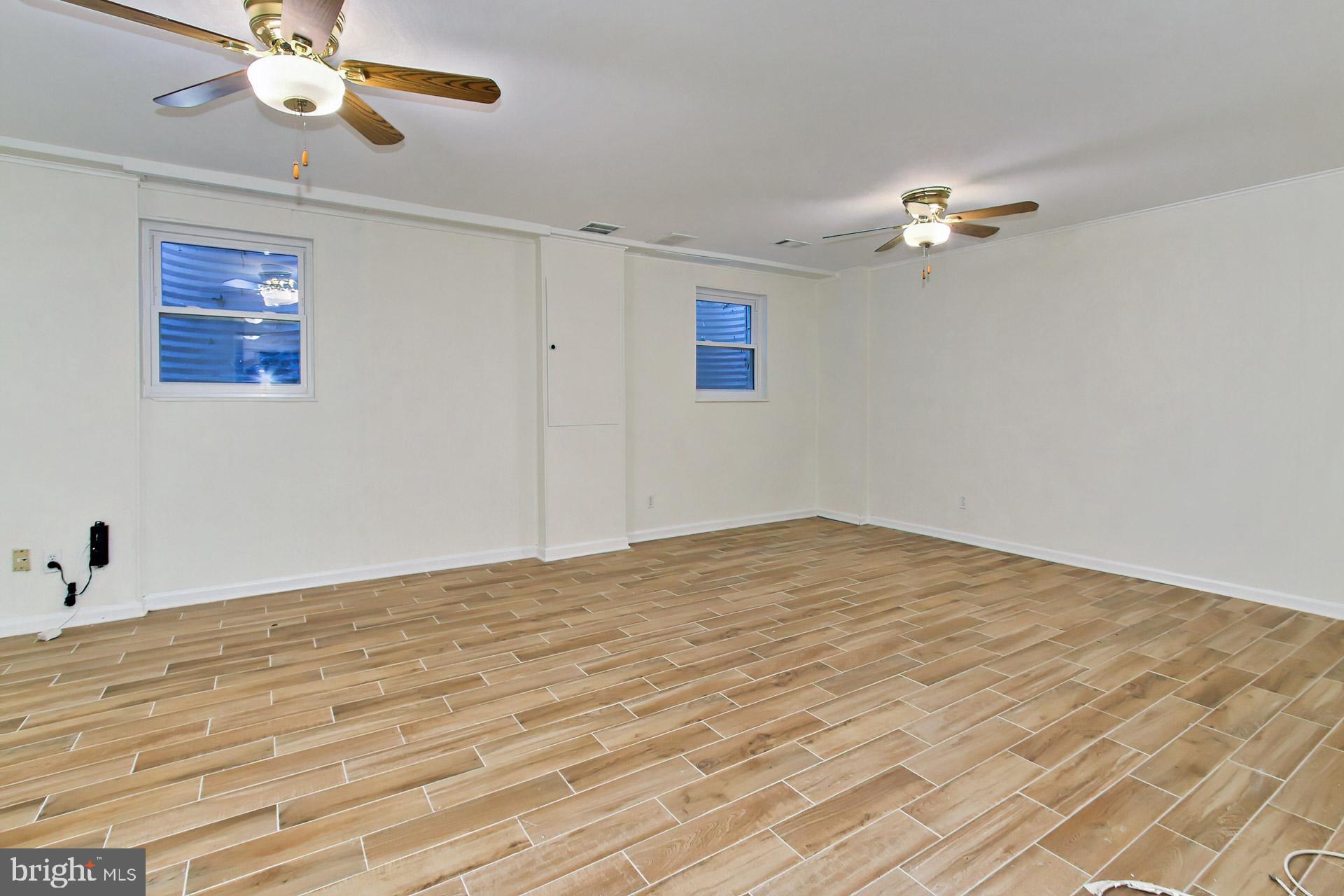 8324 Garfield Court Springfield, VA 22152 - Photo 27 of 59 Lower level family room with large windows