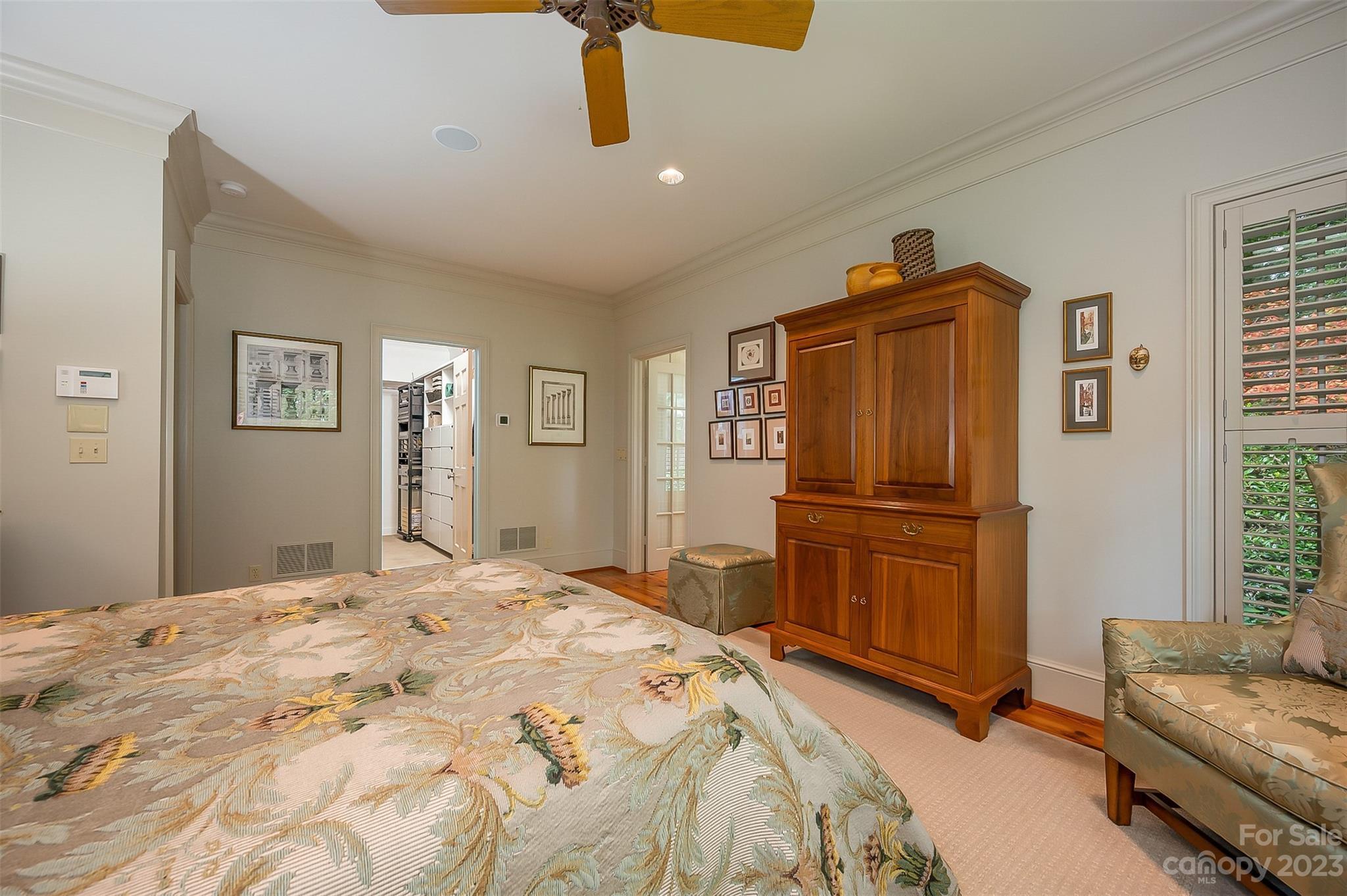 1389 Landrum Road Columbus, NC 28722 - Photo 15 of 46 a bedroom with a bed and wooden floor