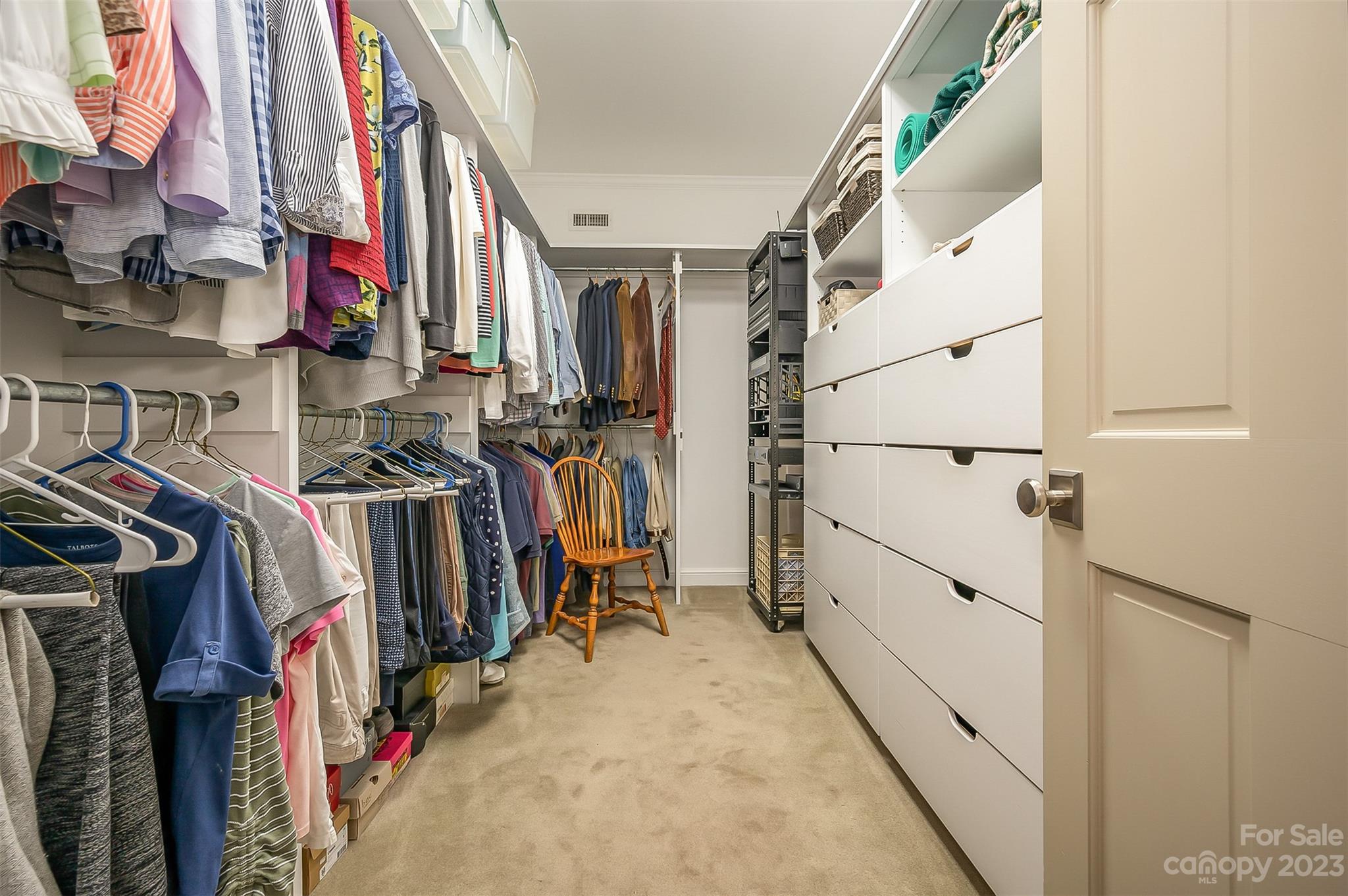 1389 Landrum Road Columbus, NC 28722 - Photo 16 of 46 a view of walk in closet with clothes and shoes