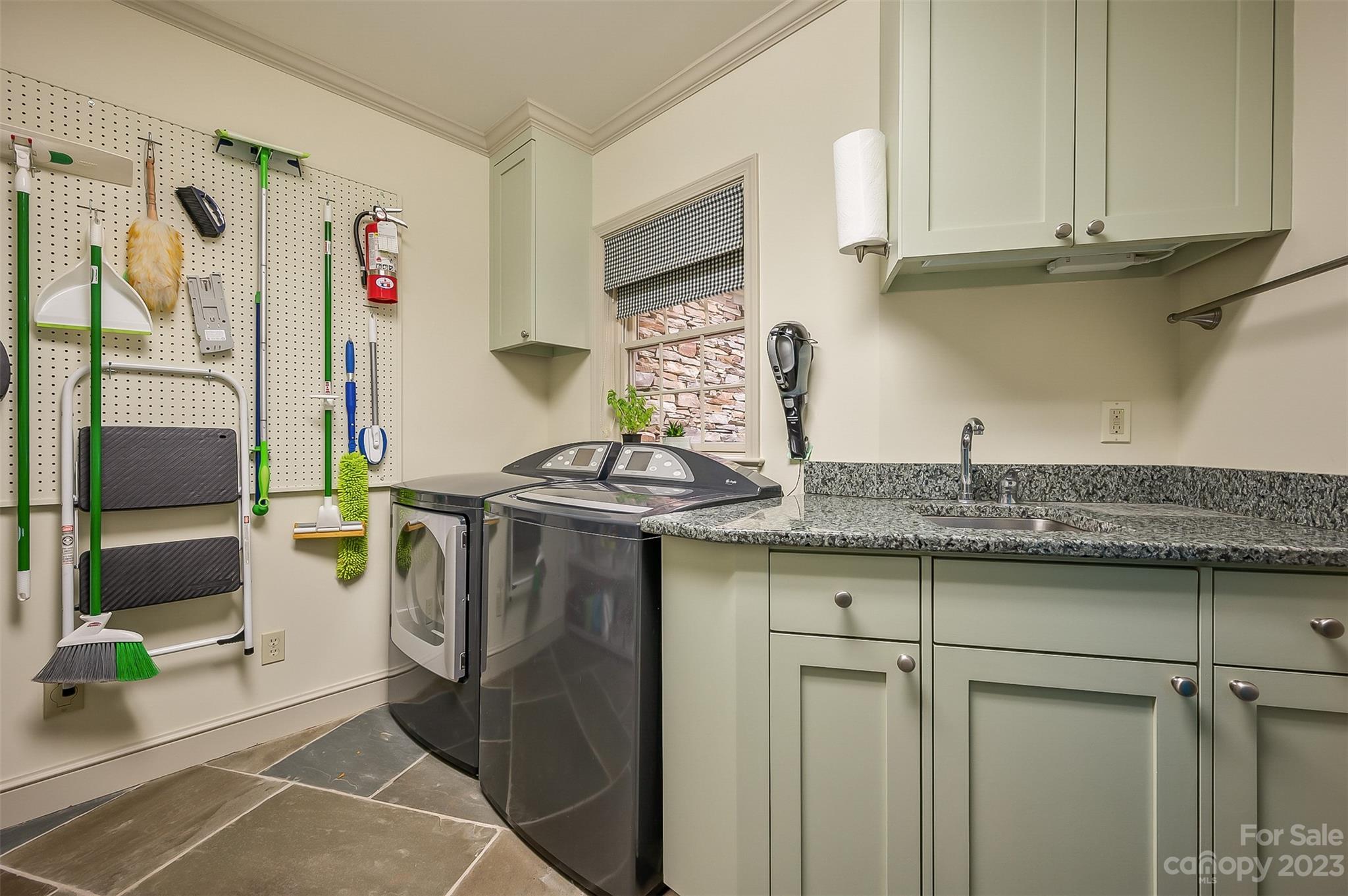 1389 Landrum Road Columbus, NC 28722 - Photo 28 of 46 a utility room with cabinets