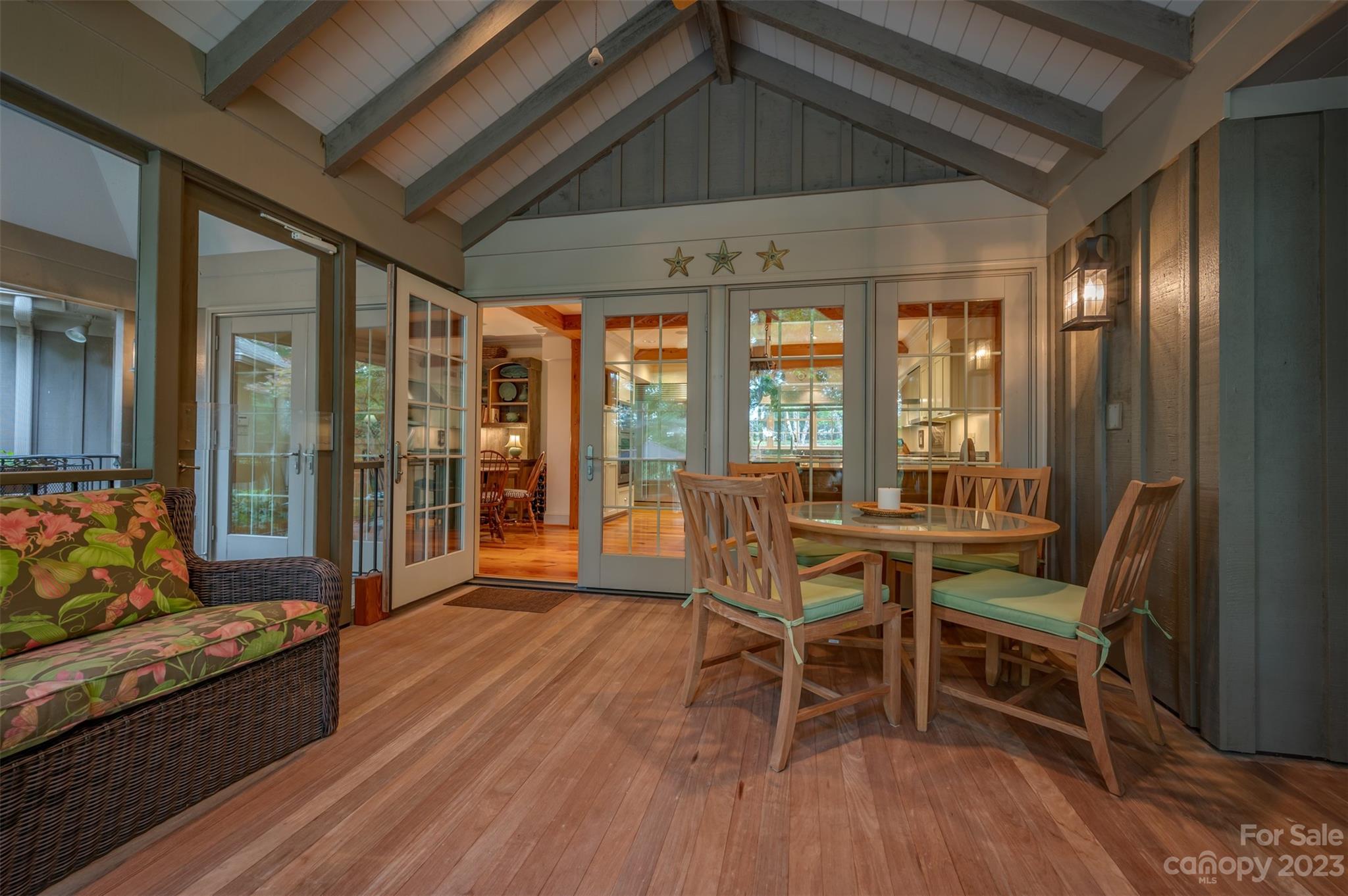1389 Landrum Road Columbus, NC 28722 - Photo 30 of 46 a dining room with furniture a chandelier and wooden floor