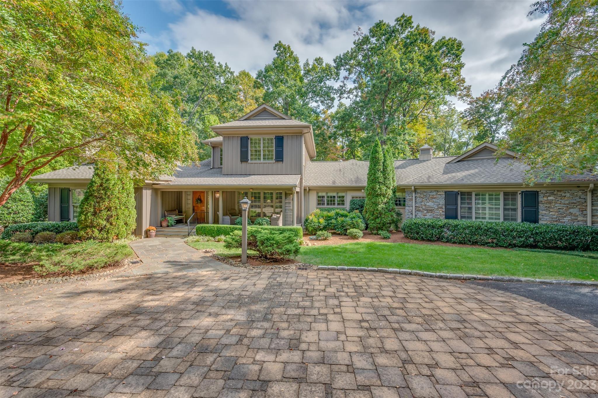 1389 Landrum Road Columbus, NC 28722 - Photo 3 of 46 a front view of a house with garden