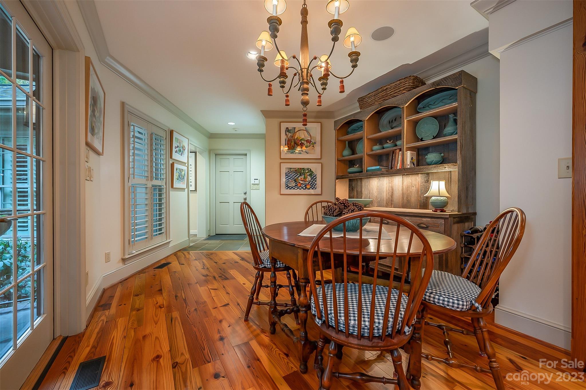 1389 Landrum Road Columbus, NC 28722 - Photo 32 of 46 a view of a dining room with furniture wooden floor and chandelier