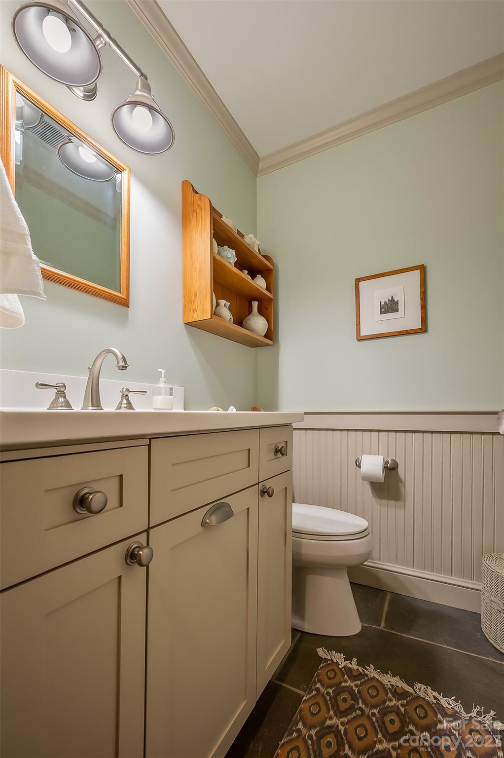 1389 Landrum Road Columbus, NC 28722 - Photo 34 of 46 a bathroom with a sink a toilet and mirror