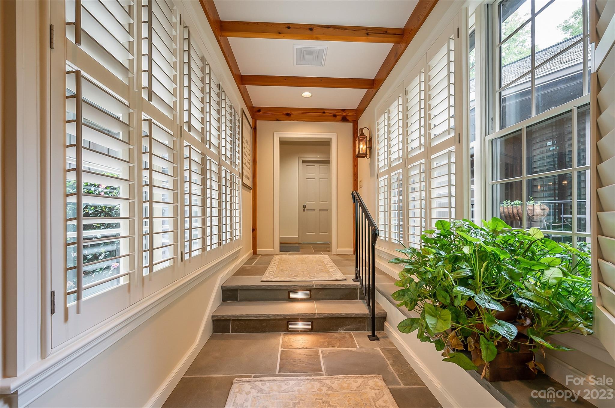 1389 Landrum Road Columbus, NC 28722 - Photo 35 of 46 a view of porch with a potted plant and a large window
