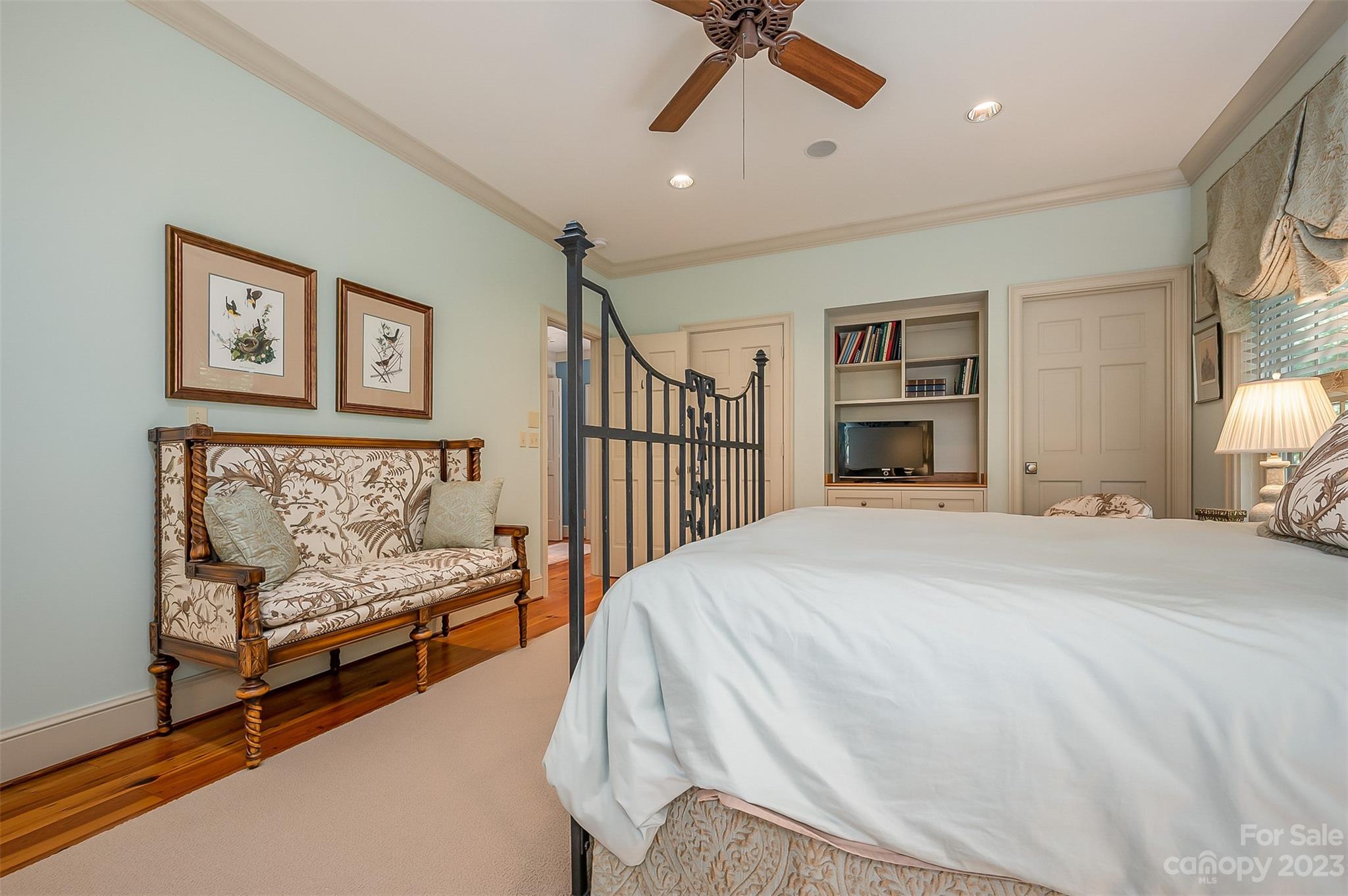 1389 Landrum Road Columbus, NC 28722 - Photo 40 of 46 a spacious bedroom with a bed and a chandelier