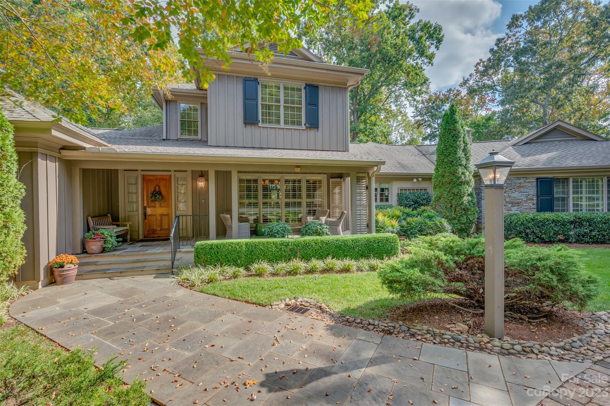 1389 Landrum Road Columbus, NC 28722 - Photo 4 of 46 a front view of a house with a garden