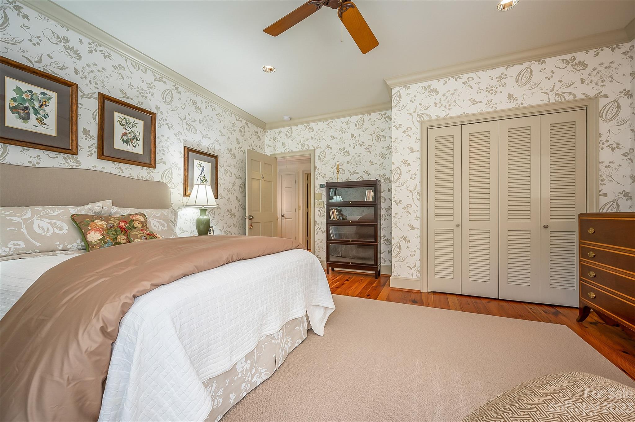 1389 Landrum Road Columbus, NC 28722 - Photo 43 of 46 a spacious bedroom with a bed and cabinets